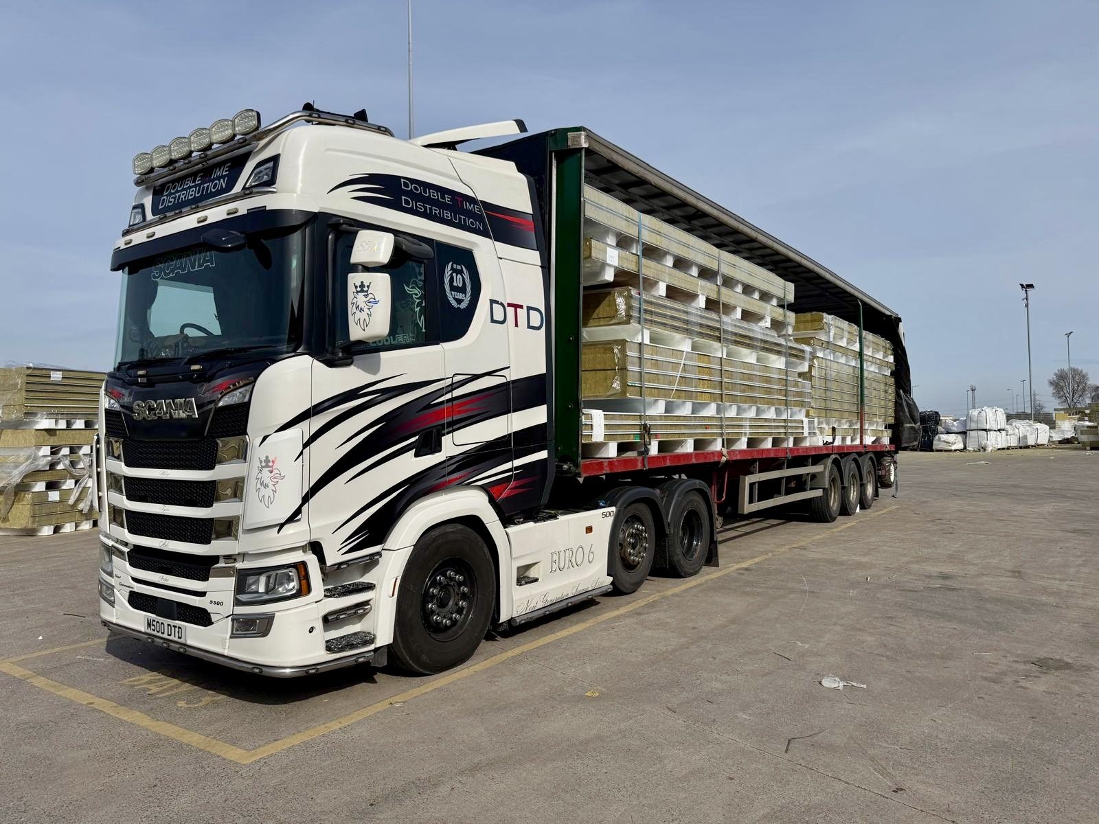 Double Time Distribution flatbed artic loaded with manufactured insulation panels