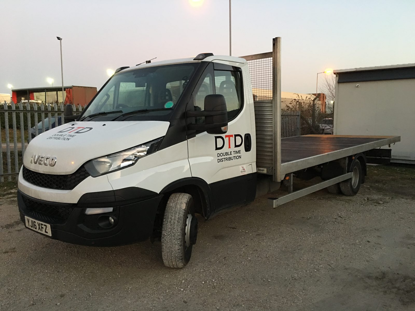 Double Time Distribution flatbed truck on a local delivery in North Wales